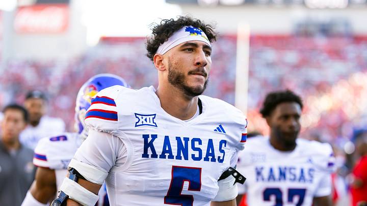 Nov 8, 2025; Tucson, Arizona, USA; Kansas Jayhawks defensive end Dean Miller (5) against the Arizona Wildcats at Arizona Stadium. Mandatory Credit: Mark J. Rebilas-Imagn Images