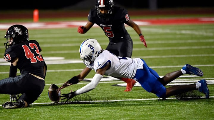 Rockvale   s Jaylan Morgan (2) dives on the ball as he recovers his fumble during a high school
