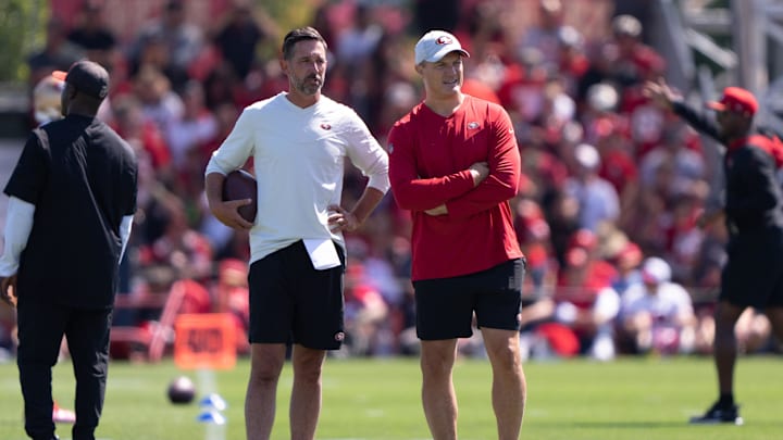 Jul 27, 2022; Santa Clara, CA, USA; San Francisco 49ers head coach Kyle Shanahan (left) and general manager John Lynch watches the players during Training Camp at the SAP Performance Facility near Levi Stadium. Mandatory Credit: Stan Szeto-Imagn Images