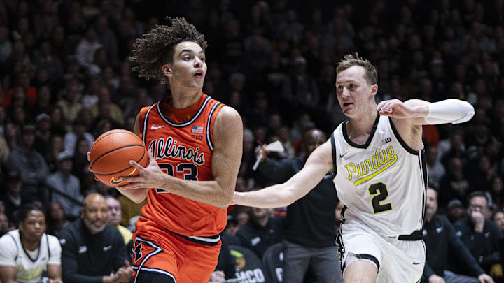 Illinois guard Keaton Wagler drives to the basket against Purdue guard Fletcher Loyer defends during the first half on Saturday.