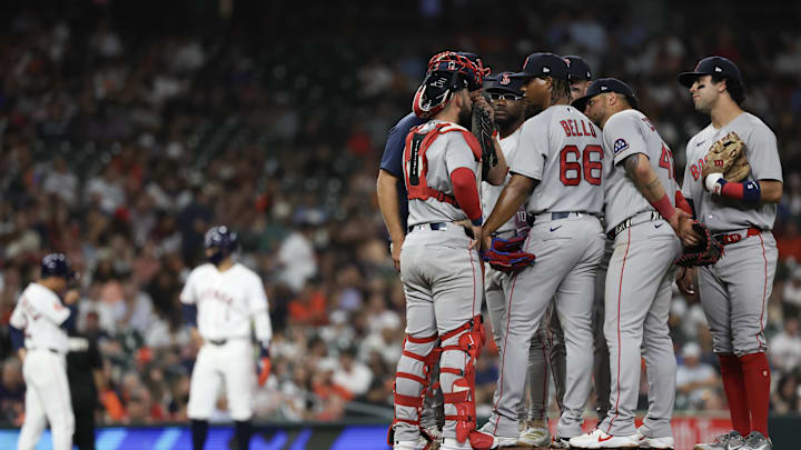 Mar 31, 2026; Houston, Texas, USA;  Boston Red Sox starting pitcher Brayan Bello (66) gets a mound visit against the Houston Astros in the fifth inning at Daikin Park. Mandatory Credit: Thomas Shea-Imagn Images