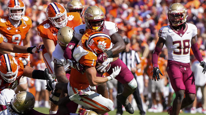 Sep 23, 2023; Clemson, South Carolina, USA; Clemson Tigers running back Will Shipley (1) is tackled by Florida State Seminoles linebacker Tatum Bethune (15) in the second half at Memorial Stadium. Sep 23, 2023; Clemson, South Carolina, USA; Clemson Tigers running back Will Shipley (1) is tackled by Florida State Seminoles linebacker Tatum Bethune (15) in the second half at Memorial Stadium.