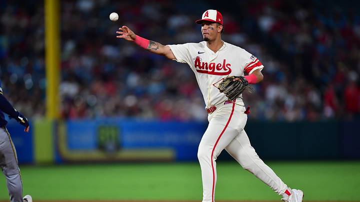 Jul 31, 2026; Anaheim, California, USA; Los Angeles Angels second baseman Vaughn Grissom (5) throws to first for the out against Milwaukee Brewers designated hitter Christian Yelich (22) during the eighth inning at Angel Stadium. Mandatory Credit: Gary A. Vasquez-Imagn Images