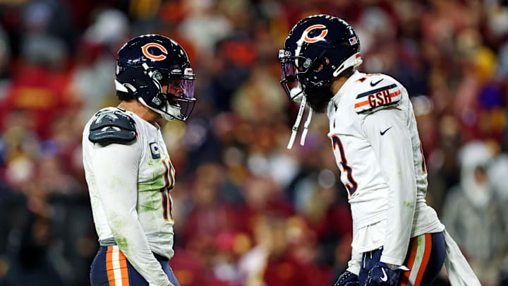 Oct 27, 2024; Landover, Maryland, USA; Chicago Bears quarterback Caleb Williams (18) celebrates with wide receiver Keenan Allen (13) after the Bears scored a touchdown during the fourth quarter against the Washington Commanders at Commanders Field. Mandatory Credit: Peter Casey-Imagn Images