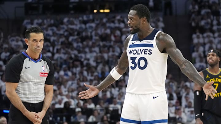 May 6, 2025; Minneapolis, Minnesota, USA; Minnesota Timberwolves forward Julius Randle (30) questions the call of referee Zach Zarba in the third quarter during game one of the second round for the 2025 NBA Playoffs with the Golden State Warriors at Target Center. Mandatory Credit: Bruce Kluckhohn-Imagn Images