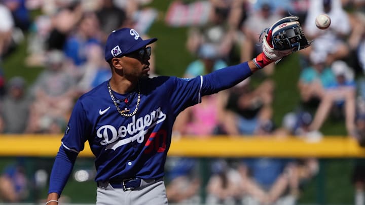 Feb 21, 2025; Mesa, Arizona, USA; Los Angeles Dodgers shortstop Mookie Betts (50) directs the outfielders during the first inning against the Chicago Cubs at Sloan Park. Mandatory Credit: Rick Scuteri-Imagn Images Feb 21, 2025; Mesa, Arizona, USA; Los Angeles Dodgers shortstop Mookie Betts (50) directs the outfielders during the first inning against the Chicago Cubs at Sloan Park. Mandatory Credit: Rick Scuteri-Imagn Images