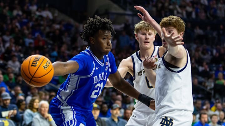 Feb 24, 2026; South Bend, Indiana, USA; Duke Blue Devils center Patrick Ngongba (21) passes as Notre Dame Fighting Irish forward Brady Koehler (6) and forward Ryder Frost (7) defend during the second half at Purcell Pavilion at the Joyce Center. Mandatory Credit: Michael Caterina-Imagn Images
