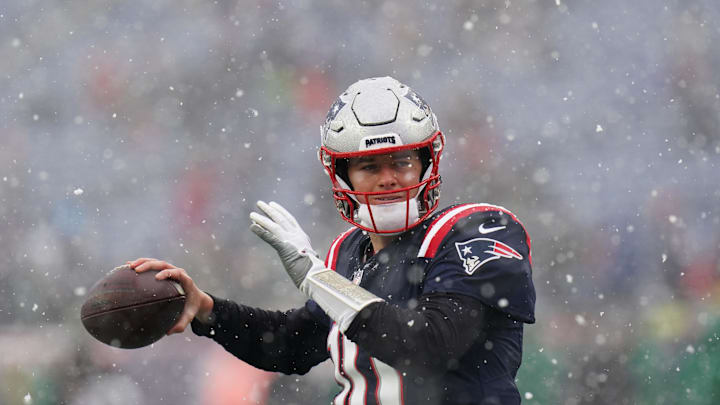 Jan 7, 2024; Foxborough, Massachusetts, USA; New England Patriots quarterback Mac Jones (10) warms up before the start of the game against the New York Jets at Gillette Stadium. Mandatory Credit: David Butler II-Imagn Images