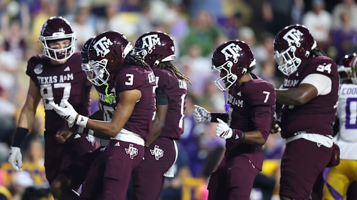 Oct 25, 2025; Baton Rouge, Louisiana, USA; Texas A&M Aggies quarterback Marcel Reed (10) celebrates with teammates after a touchdown during the first half against the Louisiana State Tigers at Tiger Stadium. Mandatory Credit: Stephen Lew-Imagn Images Oct 25, 2025; Baton Rouge, Louisiana, USA; Texas A&M Aggies quarterback Marcel Reed (10) celebrates with teammates after a touchdown during the first half against the Louisiana State Tigers at Tiger Stadium. Mandatory Credit: Stephen Lew-Imagn Images