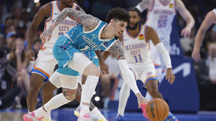 Oct 9, 2025; Oklahoma City, Oklahoma, USA; Charlotte Hornets guard Lamelo Ball (1) scrambles for a loose ball during a play against the Oklahoma City Thunder during the second quarter of a game between the Charlotte Hornets and the Oklahoma City Thunder at Paycom Center. Mandatory Credit: Alonzo Adams-Imagn Images