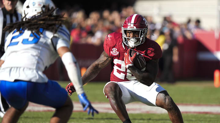 Nov 22, 2025; Tuscaloosa, Alabama, USA;  Alabama running back Jam Miller (26) attempts to cut back against Eastern Illinois defensive back Isaiah Houi (23) at Saban Field at Bryant-Denny Stadium. Mandatory Credit: Gary Cosby Jr.-Imagn Images