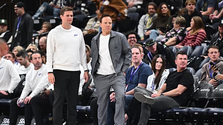 Feb 26, 2025; Salt Lake City, Utah, USA;  Utah Jazz owner Ryan Smith walks past head coach Will Hardy in the second half during a game against the Sacramento Kings at Delta Center. Mandatory Credit: Jamie Sabau-Imagn Images