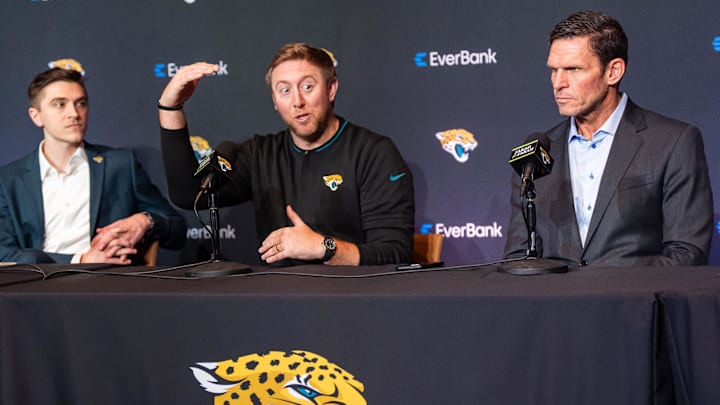 The Jacksonville Jaguars introduce General Manager James Gladstone, left, Monday morning February 24, 2025 at the Miller Electric Center in Jacksonville, Fla. as he listened to Head Coach Liam Coen, center, talk about how Gladstone was bringing a new level of skills to the organization during the press conference as Executive Vice President of Football Operations Tony Boselli, right, listened. [Doug Engle/Florida Times-Union]2025