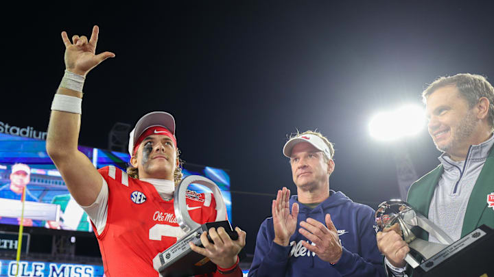 Jan 2, 2025; Jacksonville, FL, USA; Mississippi Rebels quarterback Jaxson Dart (2) is given the MVP award after beating tubes Duke Blue Devils in the Gator Bowl at EverBank Stadium. Mandatory Credit: Nathan Ray Seebeck-Imagn Images Jan 2, 2025; Jacksonville, FL, USA; Mississippi Rebels quarterback Jaxson Dart (2) is given the MVP award after beating tubes Duke Blue Devils in the Gator Bowl at EverBank Stadium. Mandatory Credit: Nathan Ray Seebeck-Imagn Images