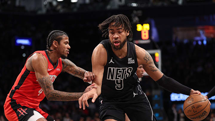 Feb 4, 2025; Brooklyn, New York, USA; Brooklyn Nets forward Trendon Watford (9) is guarded by Houston Rockets guard Jalen Green (4) during the second half at Barclays Center. Mandatory Credit: Vincent Carchietta-Imagn Images