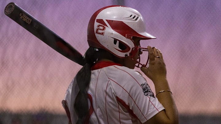 Socorro’s Mia Dominguez (2) adjusts her helmet during a District 1-6A game against Socorro at Eastlake High School on Tuesday, March 17, 2026, in El Paso, Texas.