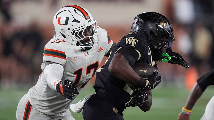 Sep 18, 2026; Winston-Salem, North Carolina, USA;  Miami (FL) Hurricanes linebacker Ezekiel Marcelin Jr. (17) chases after Wake Forest Demon Deacons tight end Kamrean Johnson (12) during the first half at Allegacy Federal Credit Union Stadium.  Mandatory Credit: Jim Dedmon-Imagn Images