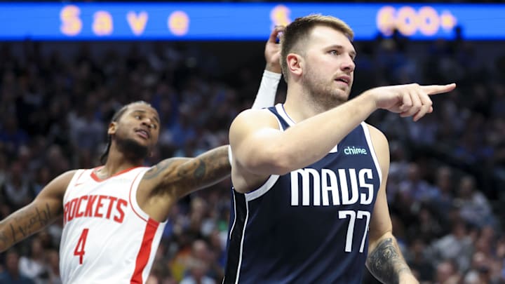 Oct 31, 2024; Dallas, Texas, USA;  Dallas Mavericks guard Luka Doncic (77) reacts after scoring in front of Houston Rockets guard Jalen Green (4) during the second half at American Airlines Center. Mandatory Credit: Kevin Jairaj-Imagn Images