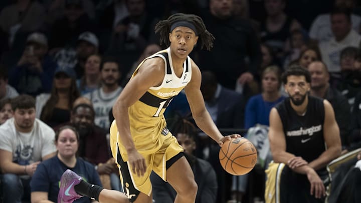 Nov 19, 2025; Minneapolis, Minnesota, USA; Washington Wizards guard Tre Johnson (12) dribbles the ball against the Minnesota Timberwolves in the second half at Target Center. Mandatory Credit: Jesse Johnson-Imagn Images