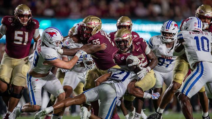 Florida State Seminoles running back Ousmane Kromah (32) tries to work his way past a defender. The SMU Mustangs defeated the Florida State Seminoles 27-24 at Doak Campbell Stadium after a game that kicked off on Monday, Sept. 7, 2026.