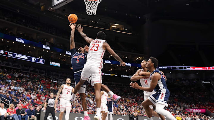 Mar 15, 2025; Kansas City, MO, USA; Arizona Wildcats guard KJ Lewis (5) shoots the ball over Houston Cougars guard Terrance Arceneaux (23) during the second half for the Big 12 Conference Tournament Championship game at T-Mobile Center. Mandatory Credit: William Purnell-Imagn Images Mar 15, 2025; Kansas City, MO, USA; Arizona Wildcats guard KJ Lewis (5) shoots the ball over Houston Cougars guard Terrance Arceneaux (23) during the second half for the Big 12 Conference Tournament Championship game at T-Mobile Center. Mandatory Credit: William Purnell-Imagn Images