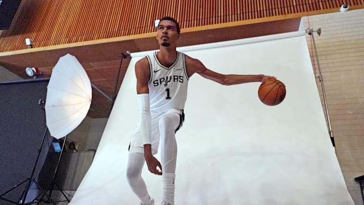 Sep 29, 2025; San Antonio, TX, USA; San Antonio Spurs forward-center Victor Wembanyama (1) poses for photos during Media Day at Victory Capital Performance Center in San Antonio. Mandatory Credit: Scott Wachter-Imagn Images