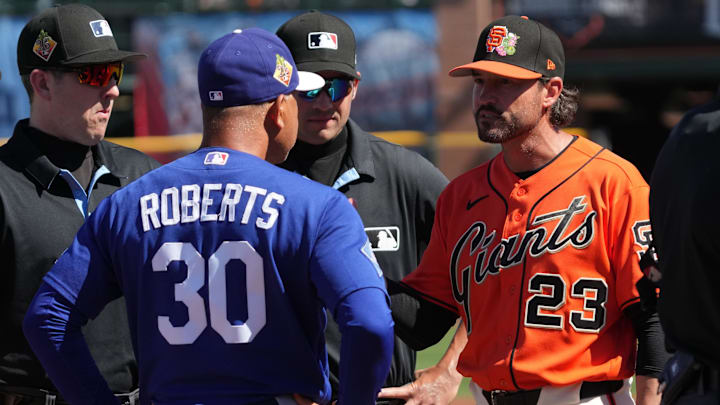 Feb 27, 2026; Scottsdale, Arizona, USA; Los Angeles Dodgers manager Dave Roberts (30) talks to San Francisco Giants manager Tony Vitello (23) before a game at Scottsdale Stadium. Mandatory Credit: Rick Scuteri-Imagn Images