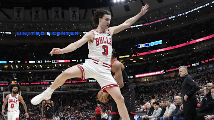 Apr 1, 2025; Chicago, Illinois, USA; Chicago Bulls guard Josh Giddey (3) defends Toronto Raptors forward Scottie Barnes (4) during the first quarter at United Center. Mandatory Credit: David Banks-Imagn Images