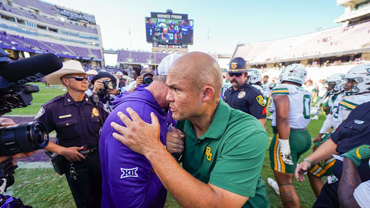 Oct 18, 2025; Fort Worth, Texas, USA; TCU Horned Frogs head coach Sonny Dykes and Baylor Bears head coach Dave Aranda meet at midfield following a game at Amon G. Carter Stadium. Mandatory Credit: Raymond Carlin III-Imagn Images Oct 18, 2025; Fort Worth, Texas, USA; TCU Horned Frogs head coach Sonny Dykes and Baylor Bears head coach Dave Aranda meet at midfield following a game at Amon G. Carter Stadium. Mandatory Credit: Raymond Carlin III-Imagn Images