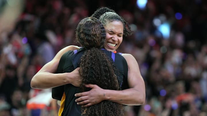 Sep 28, 2025; Phoenix, Arizona, USA; Phoenix Mercury guard Monique Akoa Makani (8) and forward Alyssa Thomas (25) celebrate after defeating the Minnesota Lynx during game four of the second round for the 2025 WNBA Playoffs at PHX Arena. Mandatory Credit: Rick Scuteri-Imagn Images