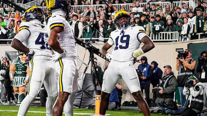 Michigan quarterback Bryce Underwood (19) celebrates a touchdown against Michigan State during the first half at Spartan Stadium in East Lansing on Saturday, October 25, 2025. Michigan quarterback Bryce Underwood (19) celebrates a touchdown against Michigan State during the first half at Spartan Stadium in East Lansing on Saturday, October 25, 2025.