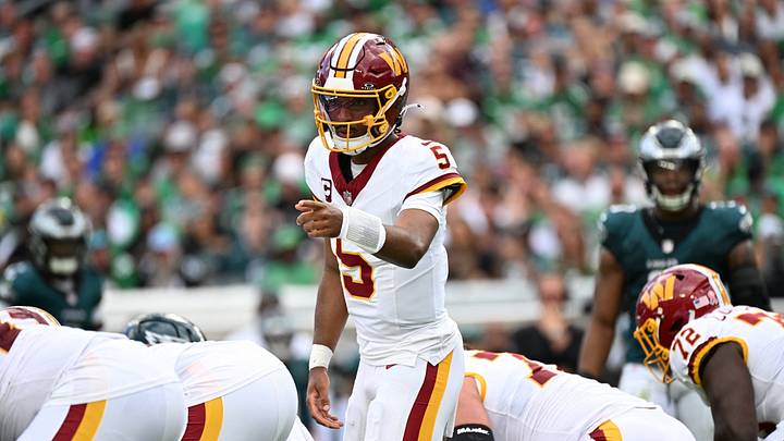 Sep 13, 2026; Philadelphia, Pennsylvania, USA;  Washington Commanders quarterback Jayden Daniels (5) directs the offense against the Philadelphia Eagles during the first half at Lincoln Financial Field.  Mandatory Credit: Eric Hartline-Imagn Images