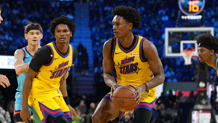 Feb 14, 2025; San Francisco, California, USA; Team M guard Ausar Thompson (9) of the Detroit Pistons and Team M guard Amen Thompson (1) of the Houston Rockets control the ball during the 2025 NBA Rising Stars Game at Chase Center. Mandatory Credit: Kyle Terada-Imagn Images