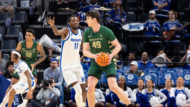 Feb 8, 2026; Memphis, Tennessee, USA; Charlotte 49ers center Anton Bonke (49) handles the ball against Memphis Tigers forward Aaron Bradshaw (11) during the first half at FedExForum. Mandatory Credit: Wesley Hale-Imagn Images Feb 8, 2026; Memphis, Tennessee, USA; Charlotte 49ers center Anton Bonke (49) handles the ball against Memphis Tigers forward Aaron Bradshaw (11) during the first half at FedExForum. Mandatory Credit: Wesley Hale-Imagn Images
