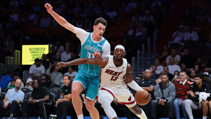 Miami Heat center Bam Adebayo (13) drives to the basket against Charlotte Hornets center Ryan Kalkbrenner 