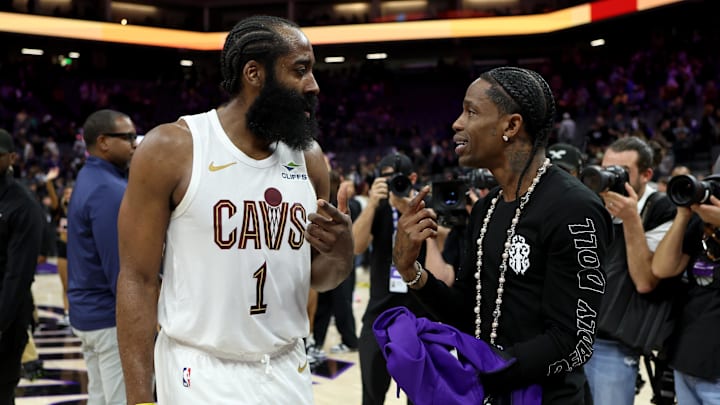 Feb 7, 2026; Sacramento, California, USA; Cleveland Cavaliers guard James Harden (1) talks with rapper Travis Scott after a game against the Sacramento Kings at Golden 1 Center. Mandatory Credit: Dennis Lee-Imagn Images