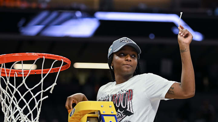 Mar 30, 2026; Sacramento, CA, USA;  South Carolina Gamecocks guard Raven Johnson (25) cuts the nets after defeating the Texas Christian University Horned Frogs in an Elite Eight game in the Sacramento Regional 4 of the women's 2026 NCAA Tournament at the Golden 1 Center. Mandatory Credit: Ed Szczepanski-Imagn Images