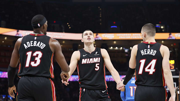 Feb 12, 2025; Oklahoma City, Oklahoma, USA; Miami Heat forward Nikola Jovic (5) celebrates with teammates center Bam Adebayo (13) and guard Tyler Herro (14) after a play against the Oklahoma City Thunder during the second quarter at Paycom Center. Mandatory Credit: Alonzo Adams-Imagn Images