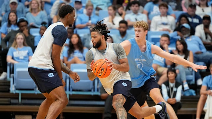 Oct 12, 2024; Chapel Hill, NC, USA;  North Carolina Tar Heels guard RJ Davis (4) with the ball as guard Cade Tyson (5) defends in the first half at the Dean E. Smith Center. Mandatory Credit: Bob Donnan-Imagn Images