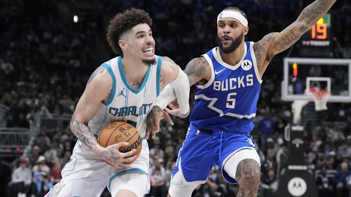 Nov 23, 2024; Milwaukee, Wisconsin, USA; Charlotte Hornets guard LaMelo Ball (1) drives to the basket against Milwaukee Bucks guard Gary Trent Jr. (5) in the second half at Fiserv Forum. Mandatory Credit: Michael McLoone-Imagn Images Nov 23, 2024; Milwaukee, Wisconsin, USA; Charlotte Hornets guard LaMelo Ball (1) drives to the basket against Milwaukee Bucks guard Gary Trent Jr. (5) in the second half at Fiserv Forum. Mandatory Credit: Michael McLoone-Imagn Images