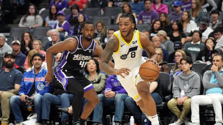 Mar 31, 2024; Sacramento, California, USA; Utah Jazz forward Brice Sensabaugh (8) dribbles against Sacramento Kings forward Harrison Barnes (40) during the fourth quarter at Golden 1 Center. Mandatory Credit: Darren Yamashita-USA TODAY Sports