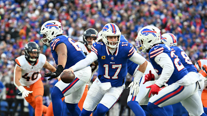 Jan 12, 2025; Orchard Park, New York, USA; Buffalo Bills quarterback Josh Allen (17) hands the ball off to running back Ty Johnson (26) during the fourth quarter against the Denver Broncos in an AFC wild card game at Highmark Stadium. Mandatory Credit: Mark Konezny-Imagn Images Jan 12, 2025; Orchard Park, New York, USA; Buffalo Bills quarterback Josh Allen (17) hands the ball off to running back Ty Johnson (26) during the fourth quarter against the Denver Broncos in an AFC wild card game at Highmark Stadium. Mandatory Credit: Mark Konezny-Imagn Images