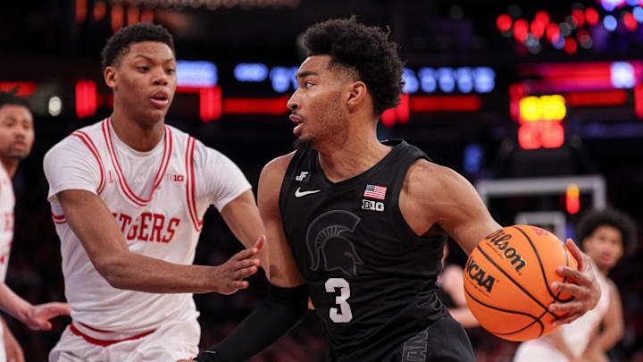 Jan 25, 2025; New York, New York, USA; Michigan State Spartans guard Jaden Akins (3) drives to the basket against Rutgers Scarlet Knights guard Ace Bailey (4) during the second half at Madison Square Garden. Mandatory Credit: Vincent Carchietta-Imagn Images