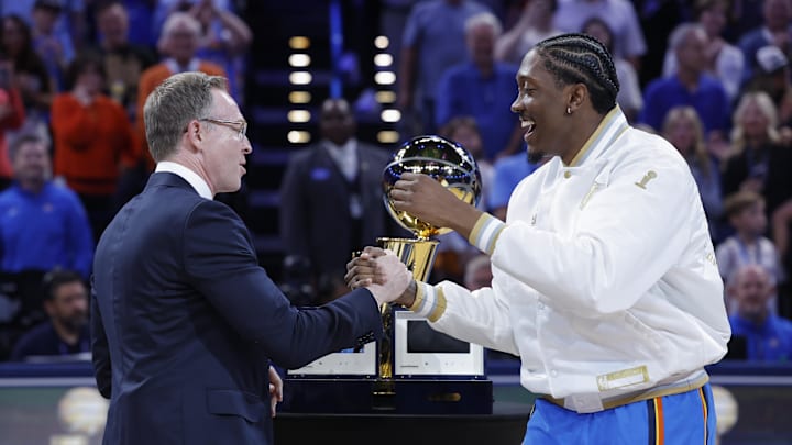 Oct 21, 2025; Oklahoma City, Oklahoma, USA; Oklahoma City Thunder general manager Sam Presti shakes hands with guard Jalen Williams during the championship ring ceremony before a game against the Houston Rockets at Paycom Center. Mandatory Credit: Alonzo Adams-Imagn Images