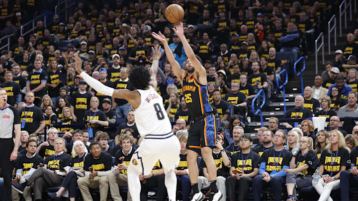 May 7, 2025; Oklahoma City, Oklahoma, USA; Oklahoma City Thunder guard Ajay Mitchell (25) shoots a three point basket over Denver Nuggets forward Peyton Watson (8) in the second half during game two of the second round for the 2025 NBA Playoffs at Paycom Center.