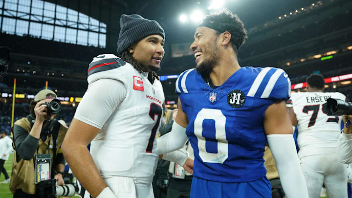 Nov 30, 2025; Indianapolis, Indiana, USA; Houston Texans quarterback C.J. Stroud (7) and Indianapolis Colts safety Cam Bynum (0) greet each other after a game at Lucas Oil Stadium. Mandatory Credit: Robert Goddin-Imagn Images