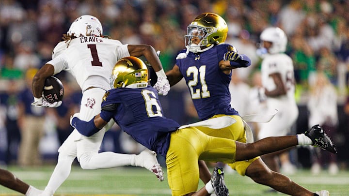 Notre Dame cornerback Christian Gray (6) tackles Texas A&M wide receiver Mario Craver (1) in the first half of a NCAA football game at Notre Dame Stadium on Saturday, Sept. 13, 2025, in South Bend.
