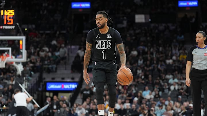 Mar 4, 2025; San Antonio, Texas, USA;  Brooklyn Nets guard D'Angelo Russell (1) dribbles in the second half against the San Antonio Spurs at Frost Bank Center. Mandatory Credit: Daniel Dunn-Imagn Images