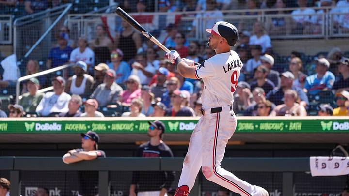 Jul 12, 2026; Minneapolis, Minnesota, USA; Minnesota Twins left fielder Trevor Larnach (9) hits a solo home run against the Los Angeles Angels in the eighth inning at Target Field. Mandatory Credit: Bruce Kluckhohn-Imagn Images