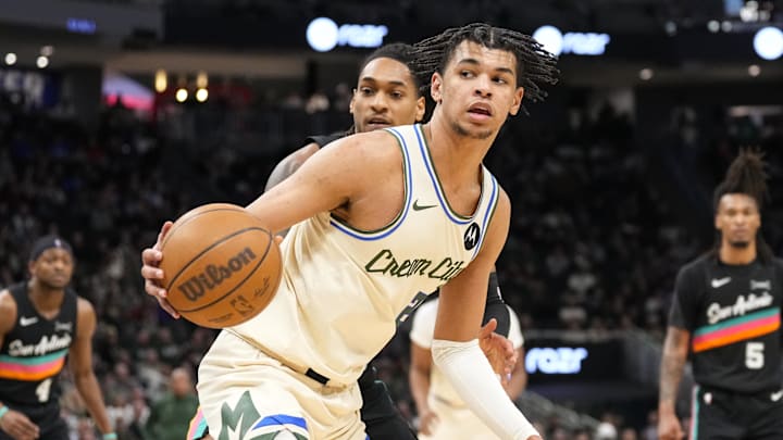 Mar 28, 2026; Milwaukee, Wisconsin, USA;  Milwaukee Bucks forward Ousmane Dieng (21) controls the ball during the third quarter against the San Antonio Spurs at Fiserv Forum. Mandatory Credit: Jeff Hanisch-Imagn Images